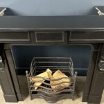 Beautiful deep antique wrap-around fireplace. This fireplace has nice deep side plates, making it perfect for putting in a working fireplace. The fireplace has been re-polished, giving it a beautiful deep shine.